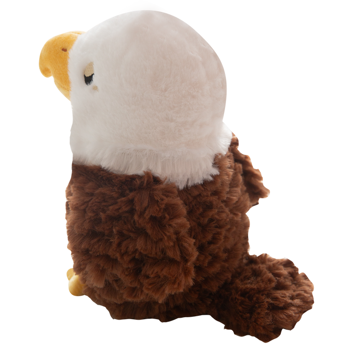 Evan the Eagle by Snugarooz is a plush dog toy featuring a white head, yellow beak and feet, brown fuzzy body, and small black eyes, shown on a plain white background.